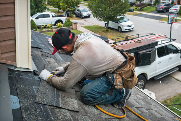 Professional Gutter Repair And Installation technician working in Sandy Spring, MD